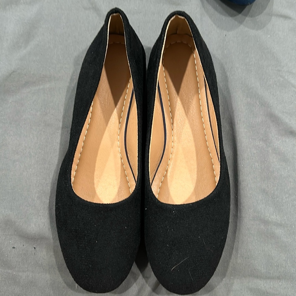 Black slip on dress shoes. Size 42 in women’s.